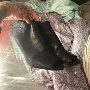 Black heeled booties with open toe